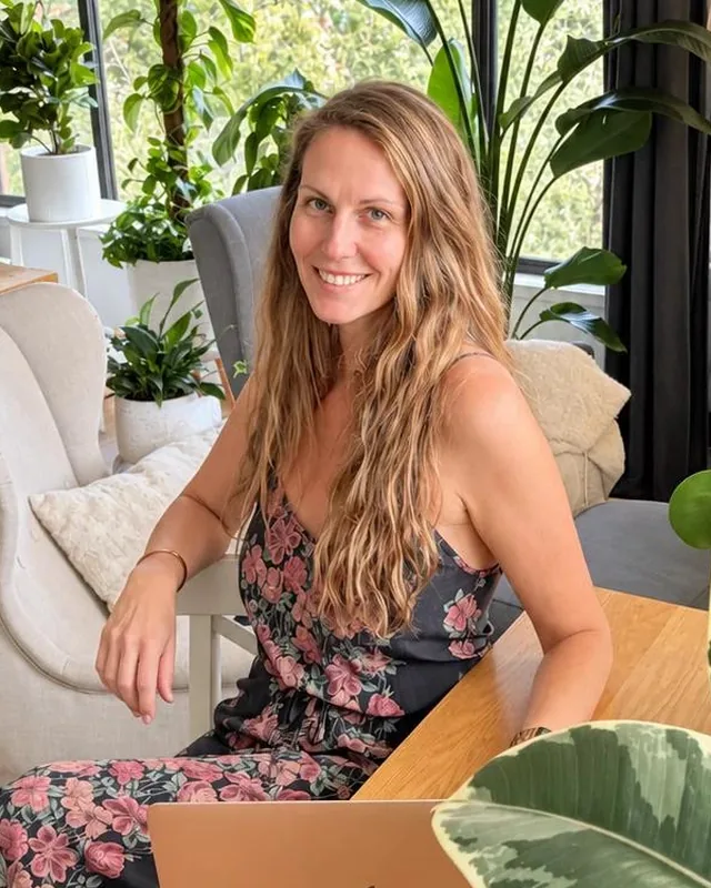 Shelley Duncan, founder of Cultivated Muse, at home with her plant collection